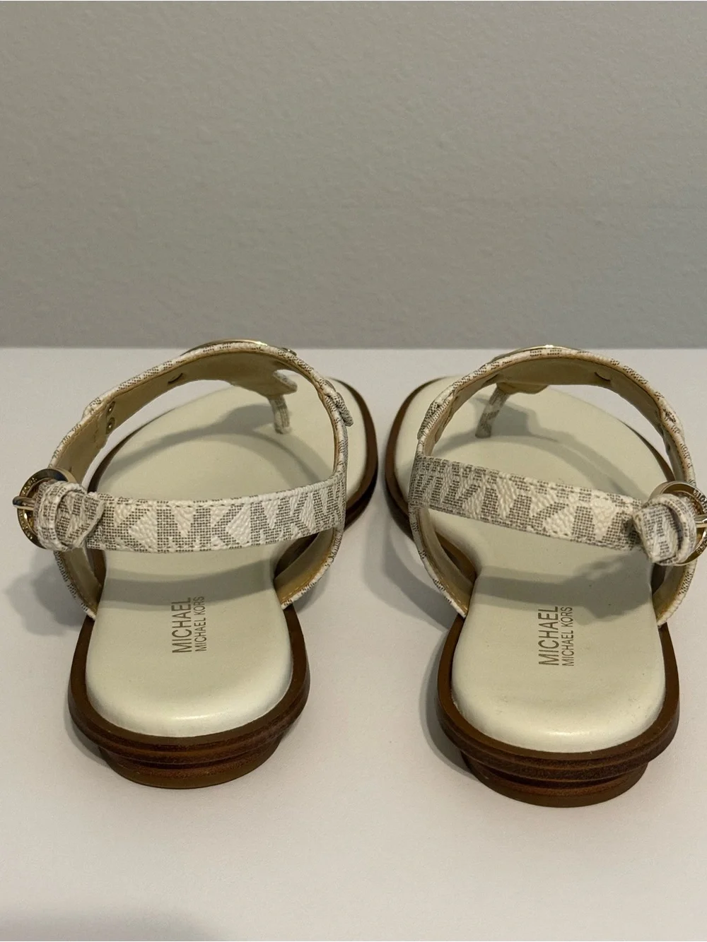 Michael Kors Cream/White Logo T-Strap Sandals with Gold Plaque